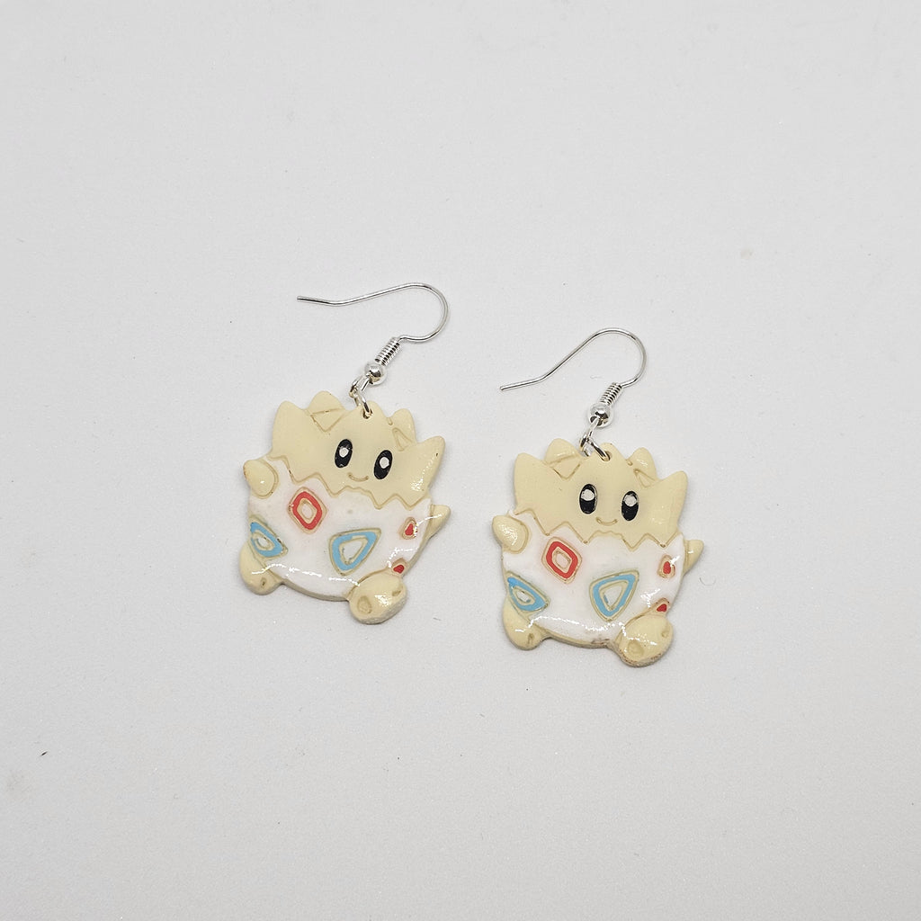 White gold dangle Pokemon Togepi earrings made out of polymer clay.