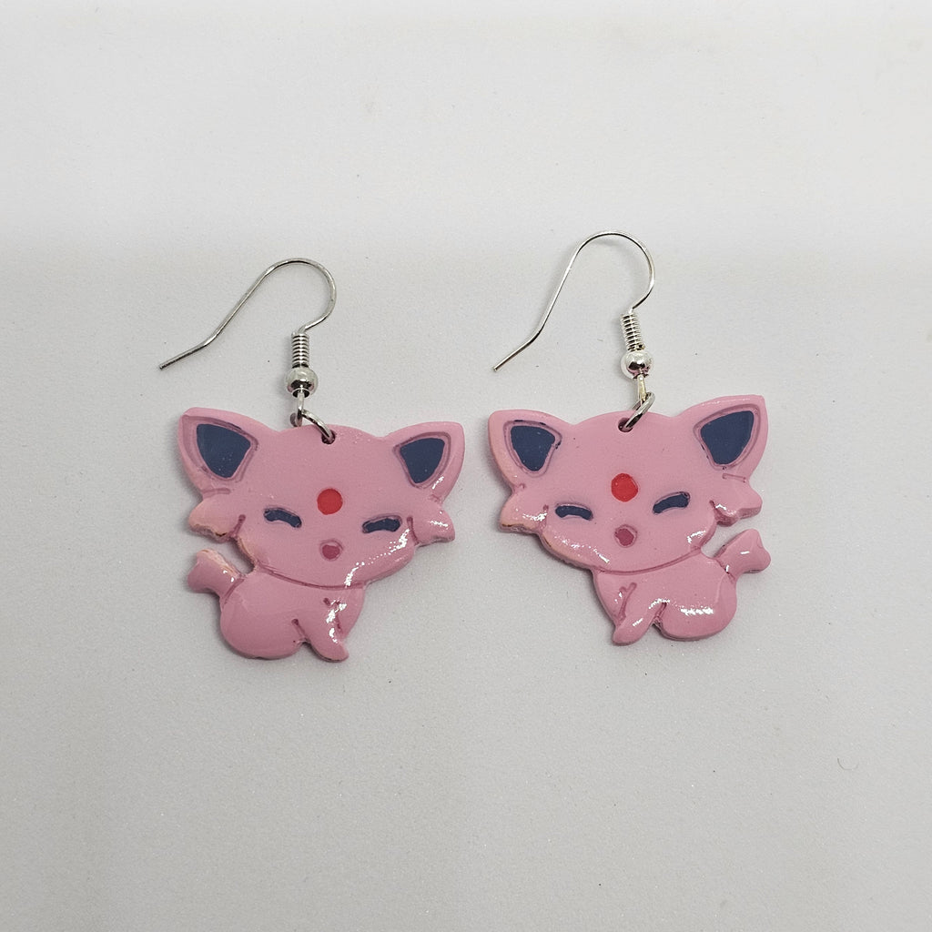White gold dangle earrings of the Pokemon Espeon made out of polymer clay.