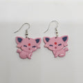 White gold dangle earrings of the Pokemon Espeon made out of polymer clay.