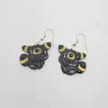 White gold dangle earrings of Pokemon Umbreon made out of polymer clay.