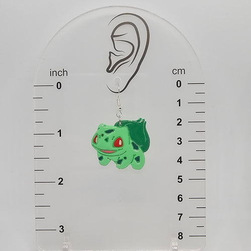 Earring on measuring device showing the earring hangs down about 1.75in from ear lobe hole.