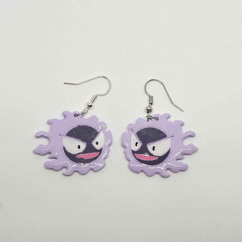 White gold dangle earring with the pokemon gastly made out of polymer clay.