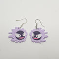 White gold dangle earring with the pokemon gastly made out of polymer clay.